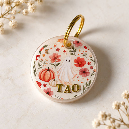Médaille pour chien personnalisée Fantôme des fleurs avec prénom doré, motif fantôme, fleurs et citrouilles automnales.