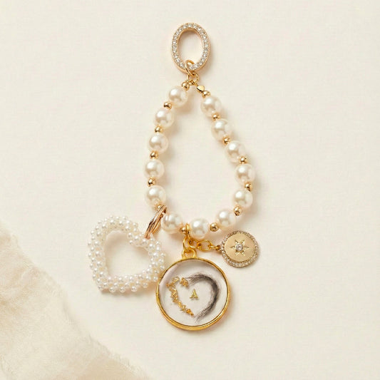 Porte-clés bijou de sac souvenir – Poils d’animal en résine, cœur & feuille d’or